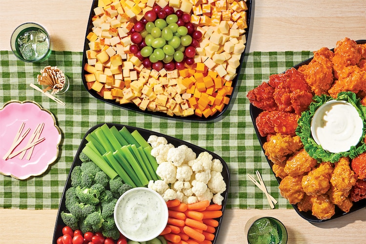 Variety of sub platters on a green checkerboard table cloth