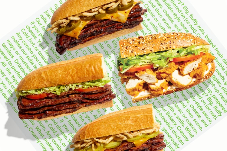 Brisket and chicken tender subs on a sub wrapper.