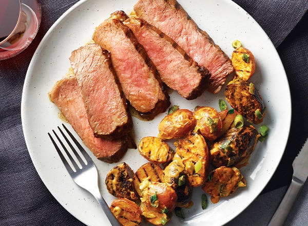 Grilled Steak with Potatoes Bravas