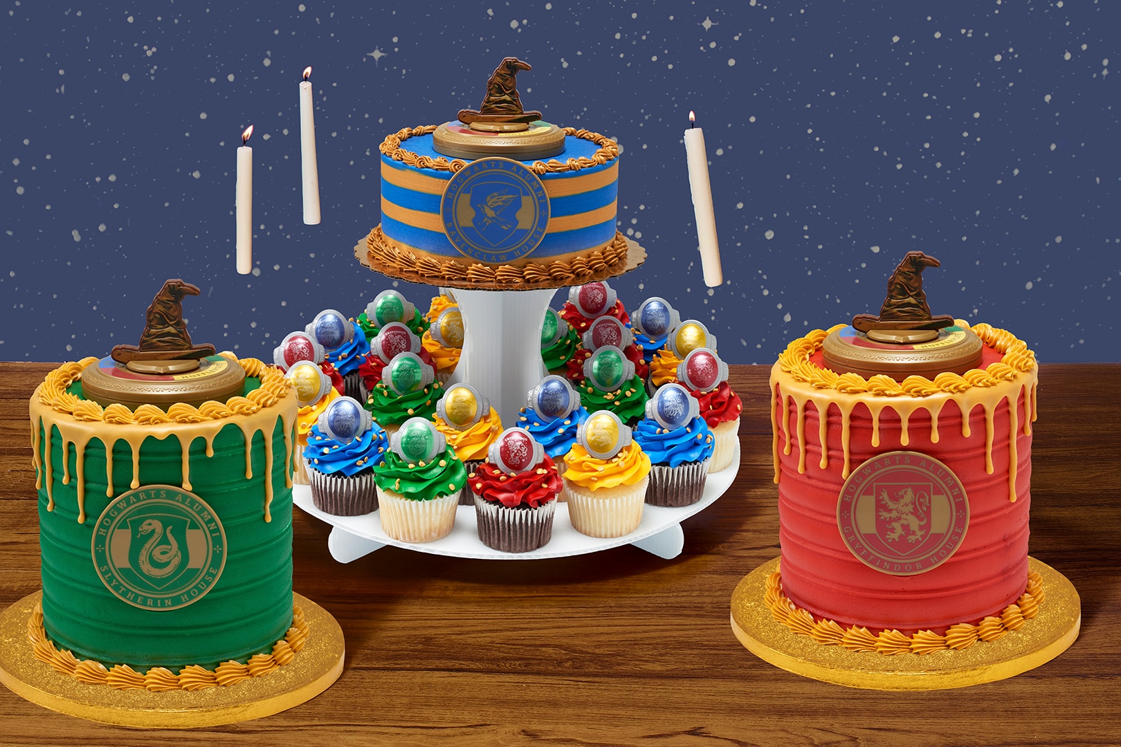 Harry Potter cakes and floating candles in front of a starry background