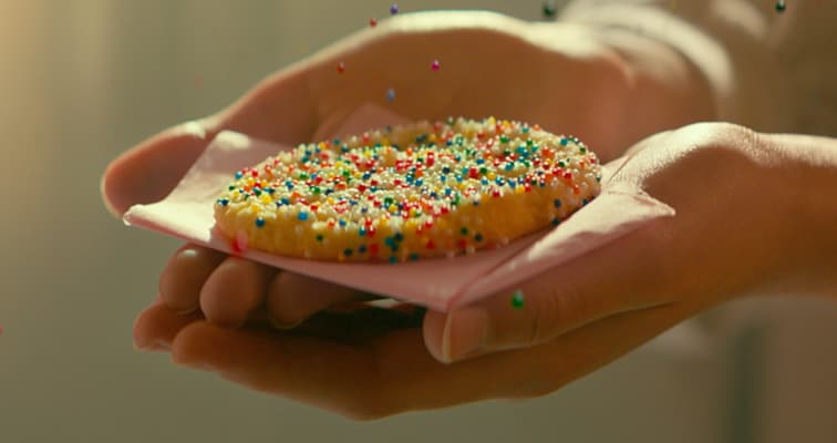 hand holding sprinkle cookie 