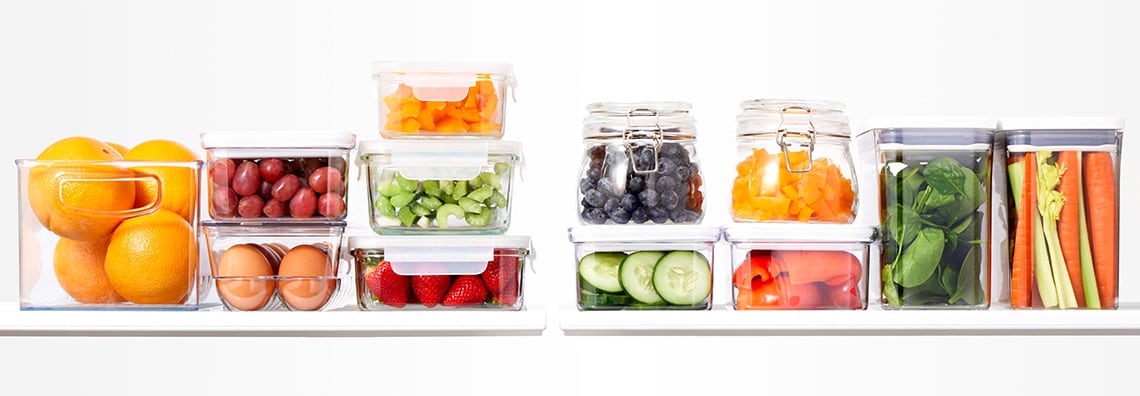 Colorful fresh foods stored in glass containers 