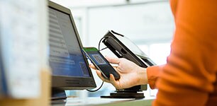 customer making touchless payment at checkout