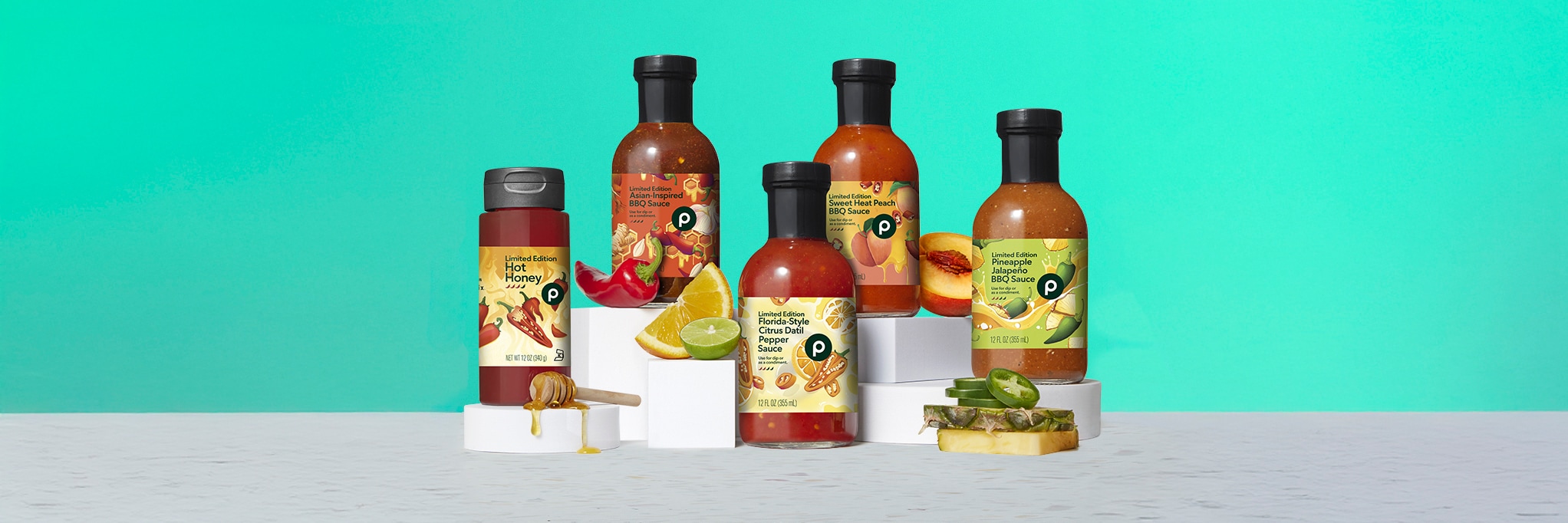 A variety of Publix limited edition sauces including Hot Honey, Asian-Inspired BBQ, Sweet Heat Peach BBQ, Florida-Style Citrus Datil, and Pineapple Jalapeño BBQ.