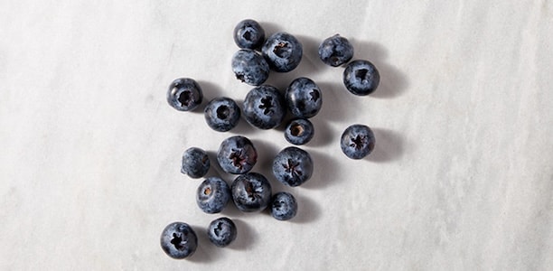 Blueberries on marble background