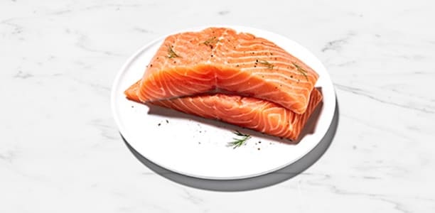 filet of raw salmon on a plate 