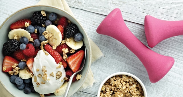 bowl of fruit and hand weights