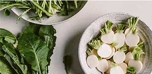 radishes cut on board and filled in bowl