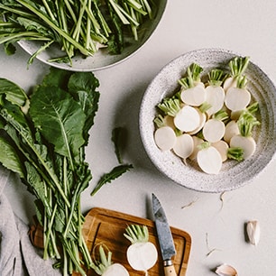 radishes cut on board and filled in bowl