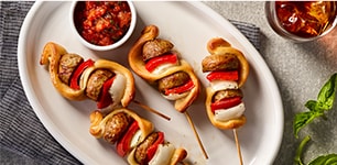 Supreme meatball skewers with Italian gravy