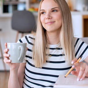 Woman holding a coffee cup