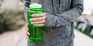 woman holding sport water bottle