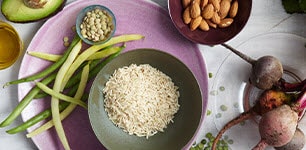 bowls of various grains, beans, and avocados