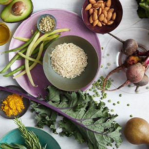 bowls of various grains, beans, and avocados