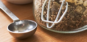 storage canister of food and measuring spoon