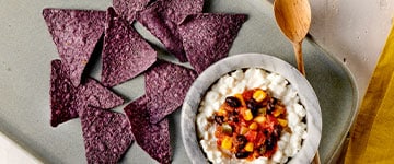 Blue tortilla chips and cottage cheese