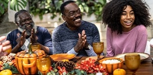 family gathered around thanksgiving table 