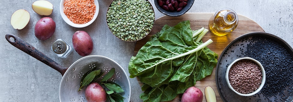 raw vegetables and bowls of beans