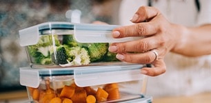 stack of fresh food in glass storage containers 