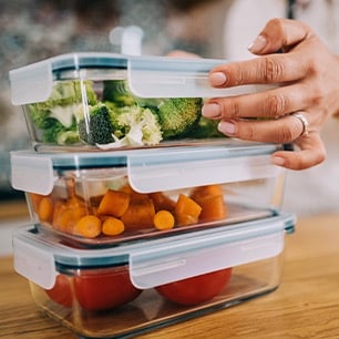 stack of fresh food in glass storage containers 