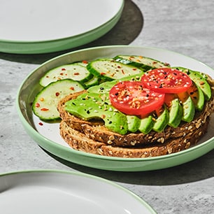 Avocado toast with tomatoes on a palte 