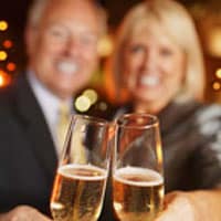 smiling couple toasting with champagne