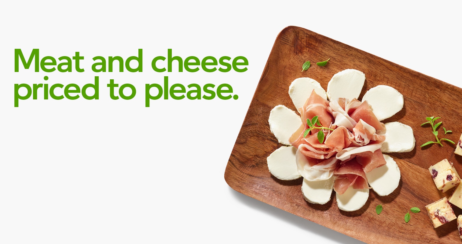Meat and cheese priced to please with an image of a charcuterie board 