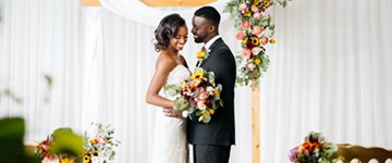 bride and groom at alter