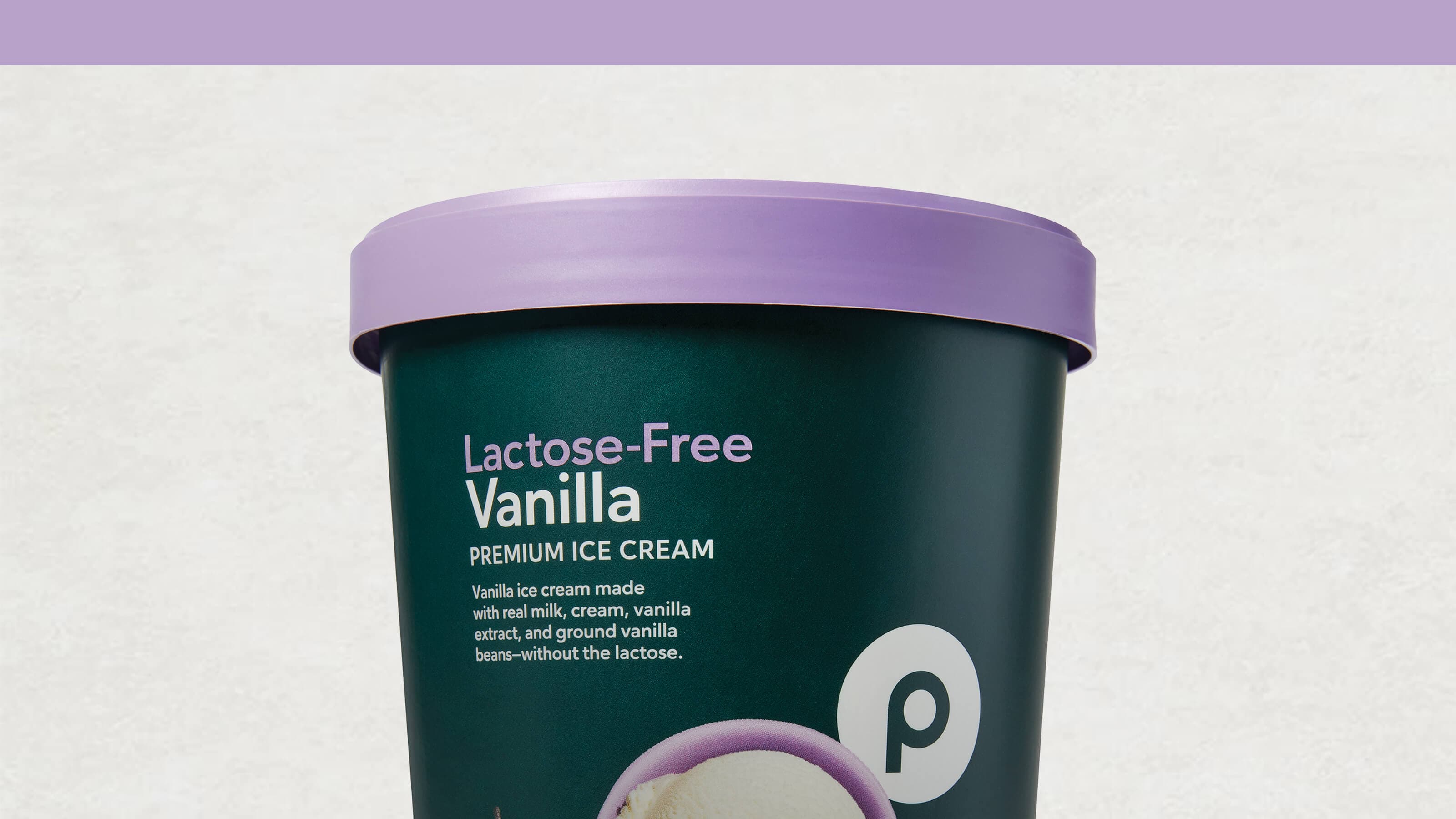 A container of Publix Lactose-Free Vanilla Premium Ice Cream with a purple lid and product details on the label.