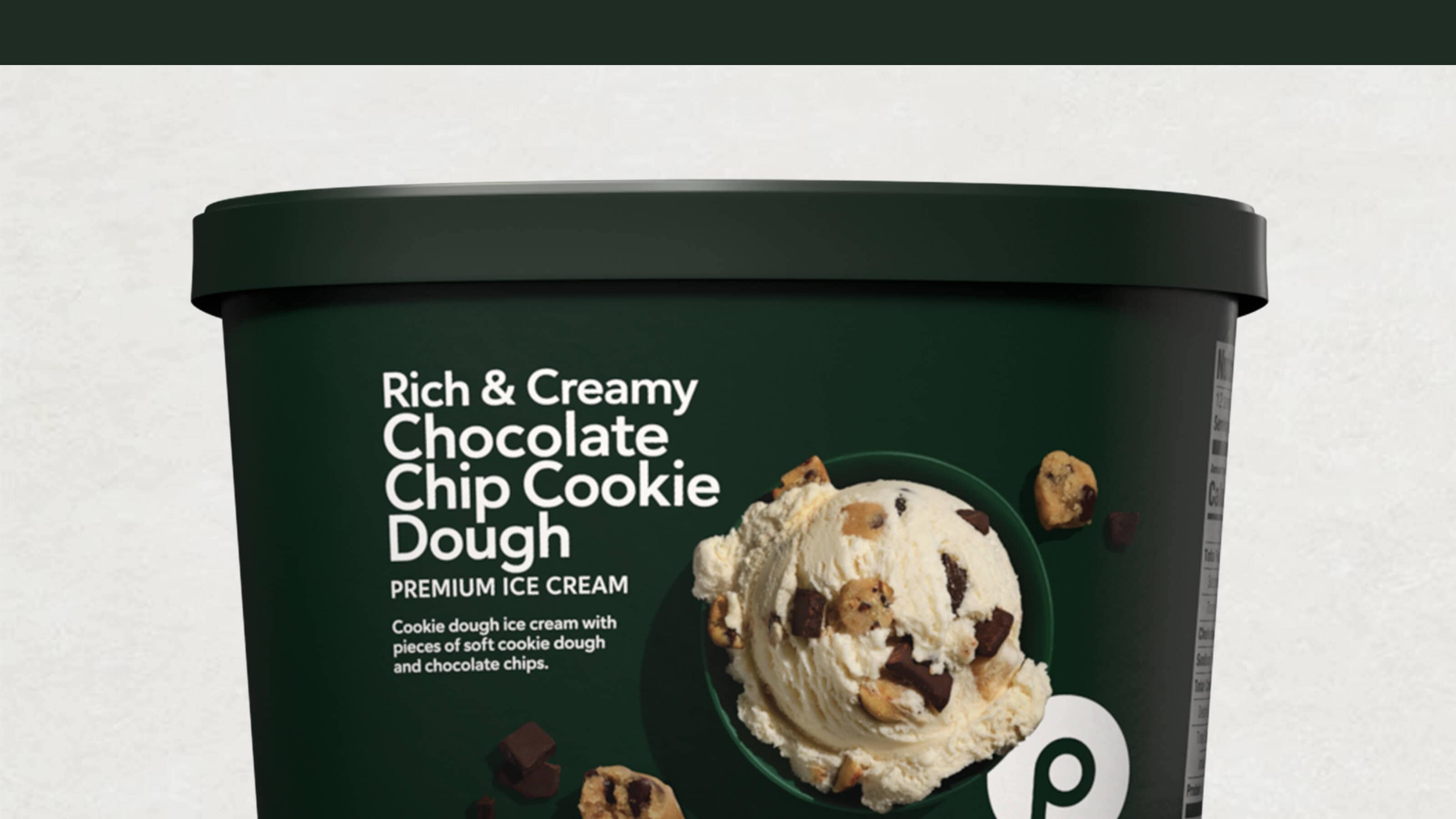 A tub of Publix Rich & Creamy Chocolate Chip Cookie Dough ice cream with cookie dough chunks and chocolate chips on the label.