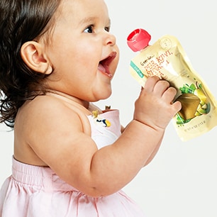Baby eating GreenWise Baby Food