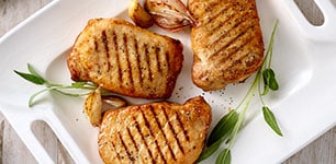 Grilled pork chops on platter