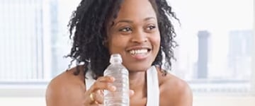 healthy woman holding a water bottle