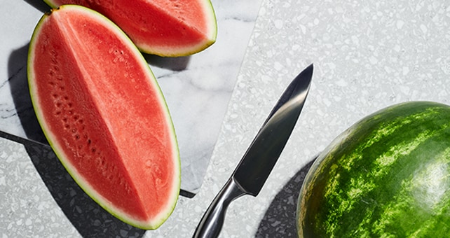 fresh watermelon on a cutting board 