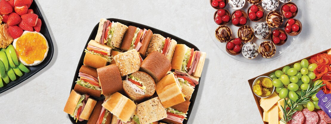 fruit platter, sub platter, dessert tart platter, and charcuterie platter 