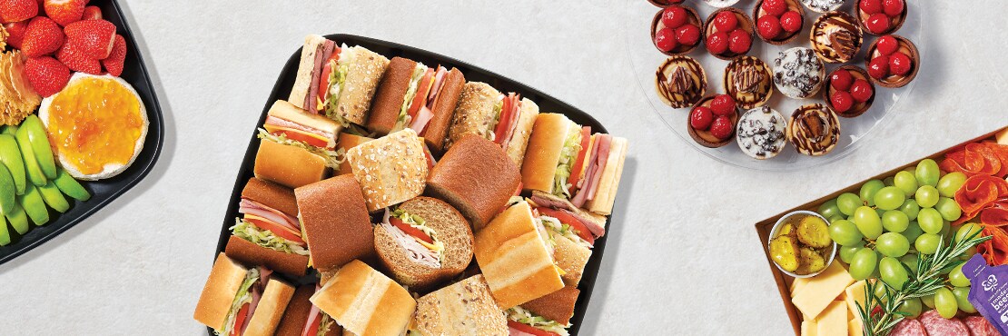 fruit platter, sub platter, dessert tart platter, and charcuterie platter 