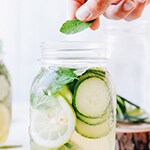 jar of cucumber slices and mint leaves