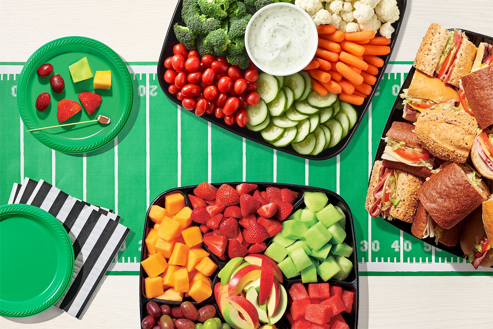 Football party platters from Publix for online order and in-store pickup, featuring subs, wings, and snacks for game day.